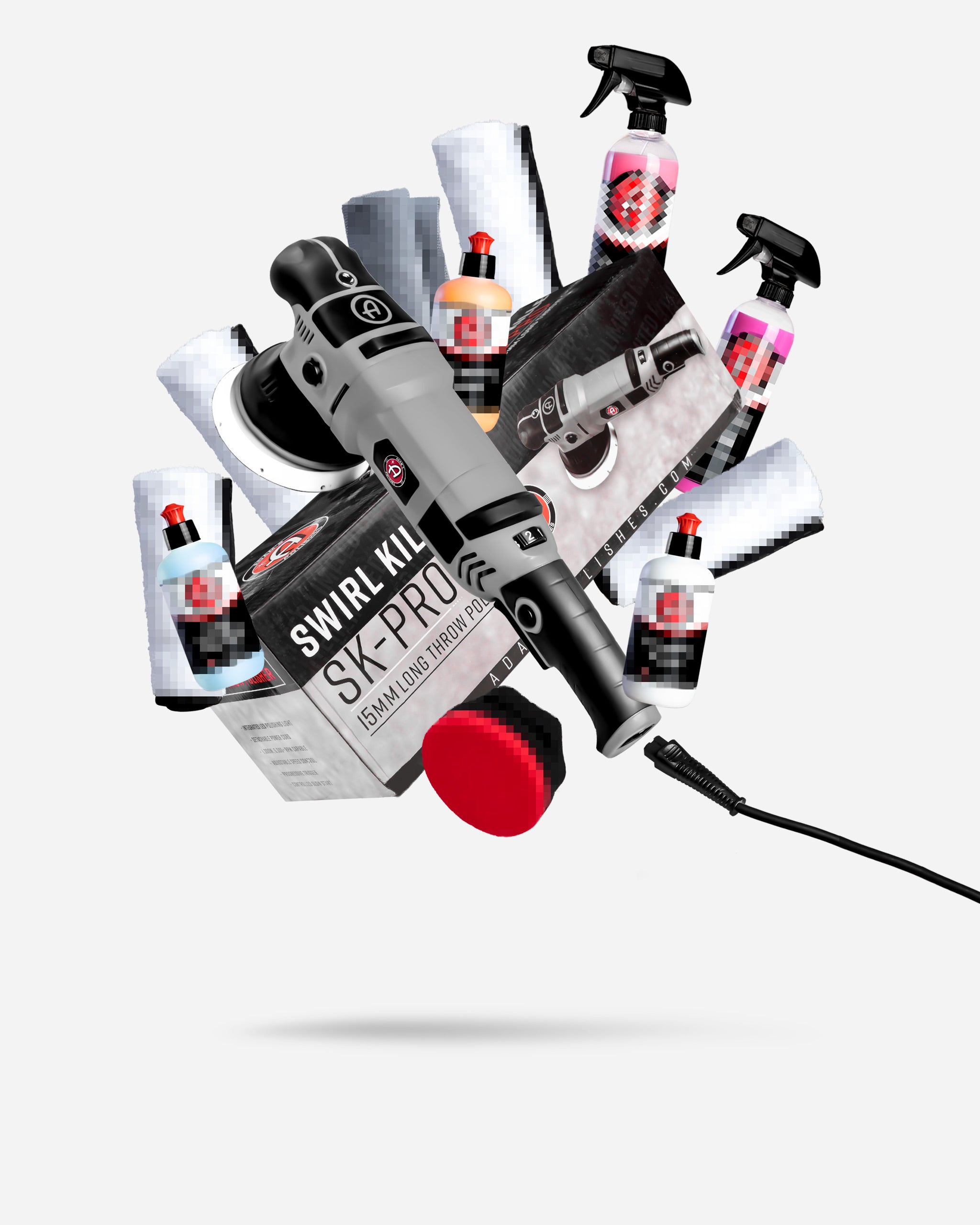 Alt text: "Adam's $299.99 SK Pro 15mm Polisher Mystery Box featuring a black and red polisher surrounded by assorted car care products including spray bottles, polishing cloths, and compounds, artistically arranged on a white background